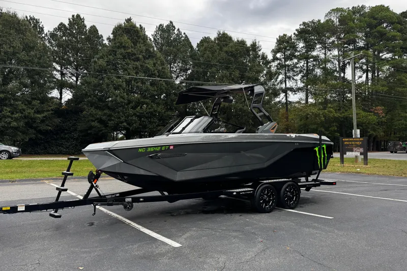 Slide: The Image of 2021 Nautique Super Air Nautique G23 boat on trailer in parking lot. - 10
