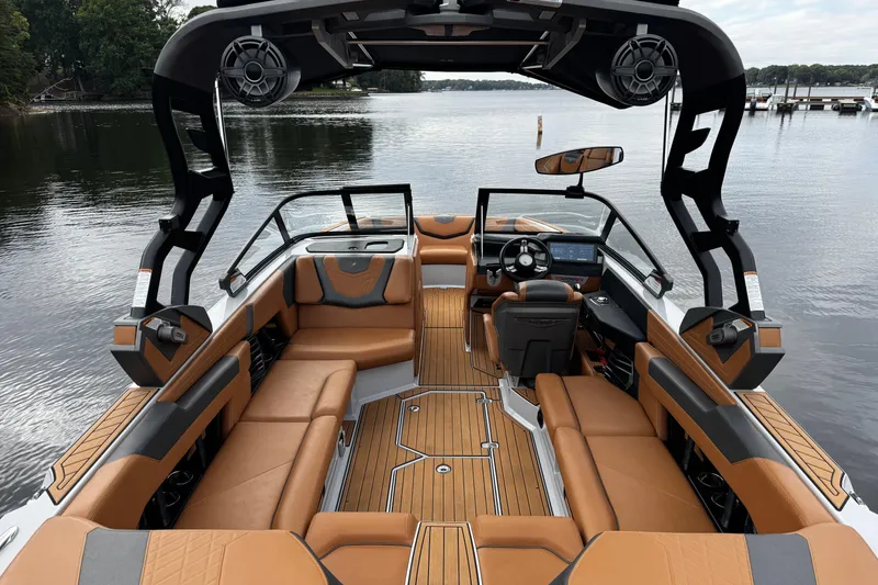 Slide: The Image of 2021 Nautique Super Air Nautique G23 boat interior with luxurious seating and modern design. - 13