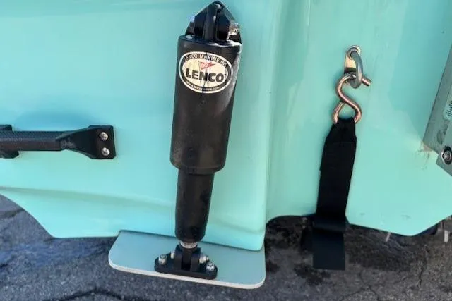 Slide: The Image of 2024 Mako 18 LTS boat with Lenco trim tab actuator. - 6