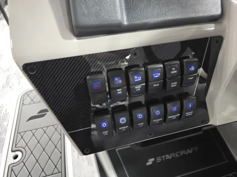 Slide: The Image of Control panel of 2026 Starcraft SLS 3 DL with various switches. - 23