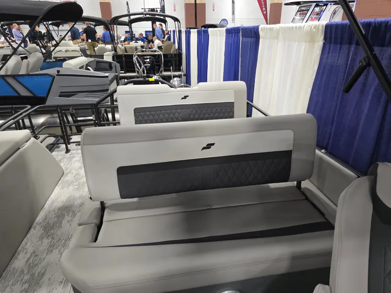 Slide: The Image of Starcraft SLS 3 DL 2026 pontoon boat displayed at a show. - 25