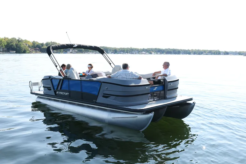 The Image of Starcraft VX 20 FD 2026 pontoon boat on a calm lake. - 0