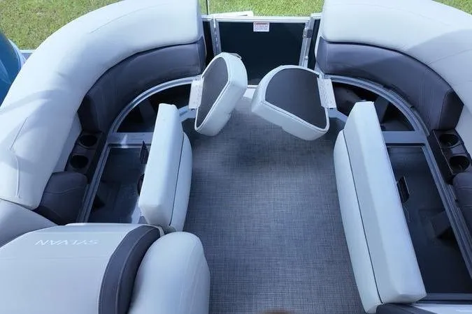 Slide: The Image of 2025 Sylvan Mirage 822 LZ boat interior with plush seating and modern design. - 10