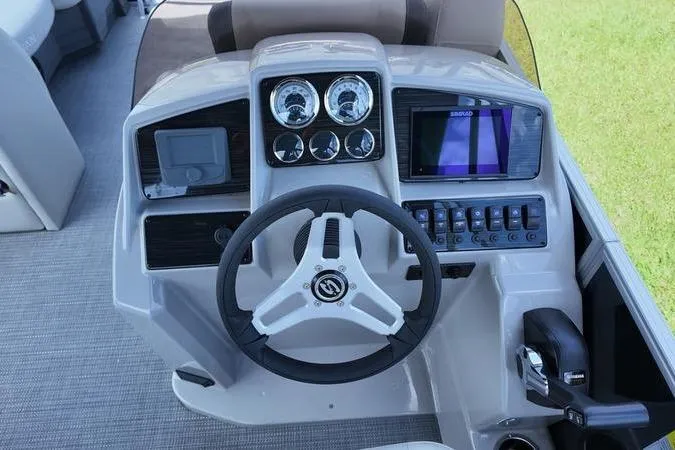 Slide: The Image of 2025 Sylvan Mirage 822 LZ boat dashboard with steering wheel and control panel. - 7