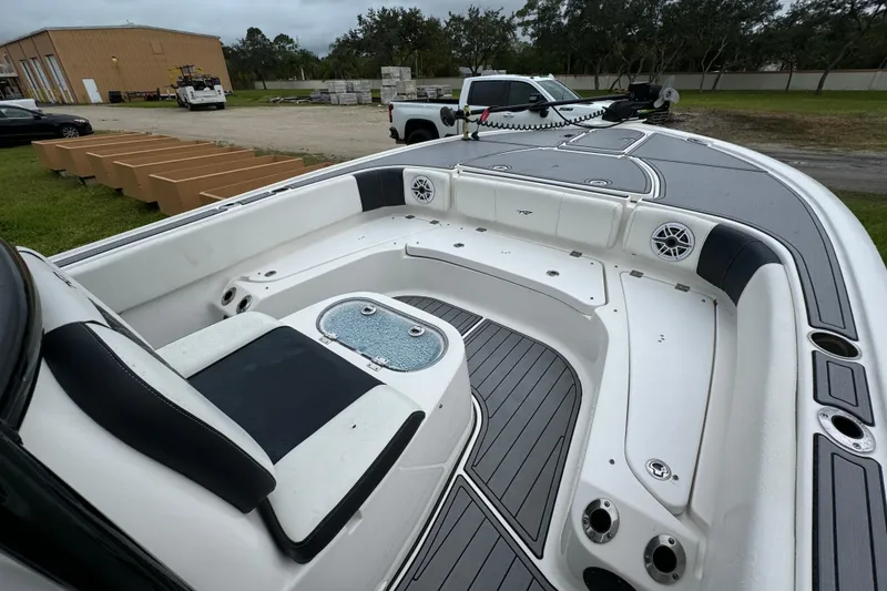 Slide: The Image of 2023 Tidewater 2700 Carolina Bay boat interior with seating and storage compartments. - 15