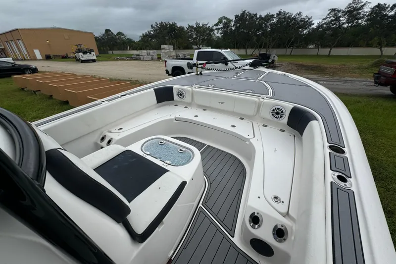 Slide: The Image of 2023 Tidewater 2700 Carolina Bay boat interior with seating and storage compartments. - 6