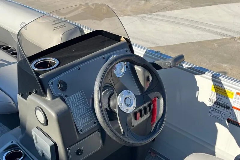 Slide: The Image of Steering console of 2026 Sun Tracker Party Barge 16 DLX pontoon boat. - 3