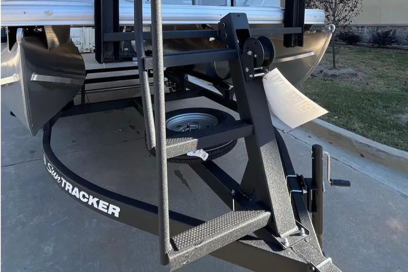 Slide: The Image of 2026 Sun Tracker Party Barge 16 DLX trailer hitch and frame close-up. - 4