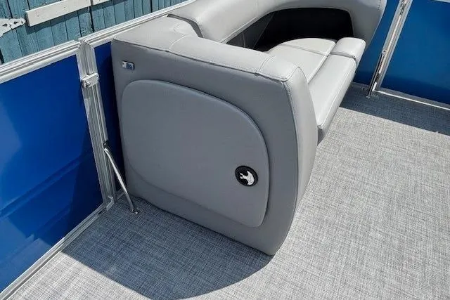 Slide: The Image of 2026 Sun Tracker Party Barge 18 DLX with gray seating and blue paneling. - 12