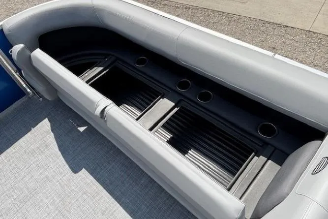 Slide: The Image of 2026 Sun Tracker Party Barge 18 DLX pontoon seating with integrated cup holders. - 9