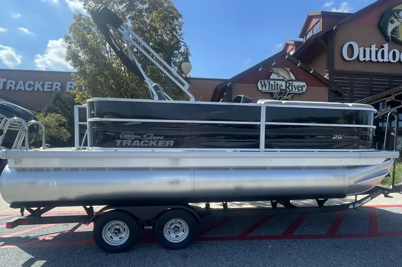 The Image of 2026 Sun Tracker Party Barge 20 DLX pontoon boat displayed outdoors, available for trade. - 0