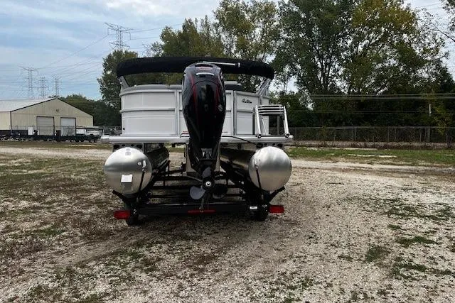 Slide: The Image of 2026 Sun Tracker Party Barge 20 DLX pontoon boat on a gravel lot. - 10