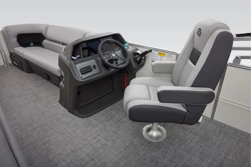 Slide: The Image of 2026 Sun Tracker Party Barge 20 DLX storage compartment with open door, showcasing interior space. - 26