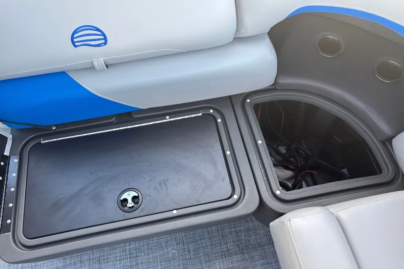 Slide: The Image of 2026 Sun Tracker Party Barge 20 DLX storage compartments with seating detail. - 23