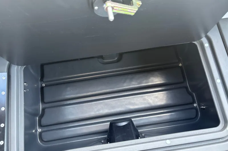Slide: The Image of Storage compartment of 2026 Sun Tracker Party Barge 20 DLX, open and empty. - 24