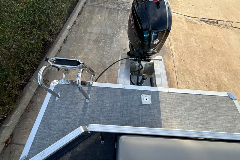 Slide: The Image of 2026 Sun Tracker Party Barge 20 DLX with outboard motor and swim ladder. - 35