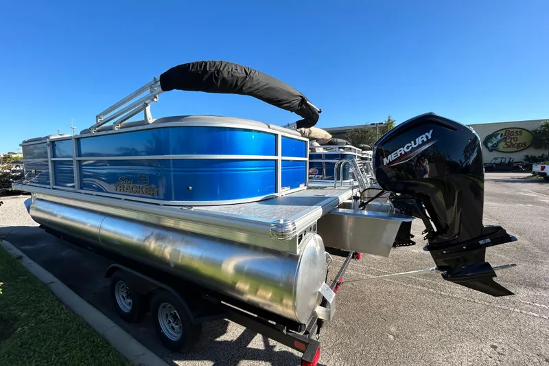 Slide: The Image of 2026 Sun Tracker Party Barge 20 DLX pontoon boat with Mercury outboard motor. - 2