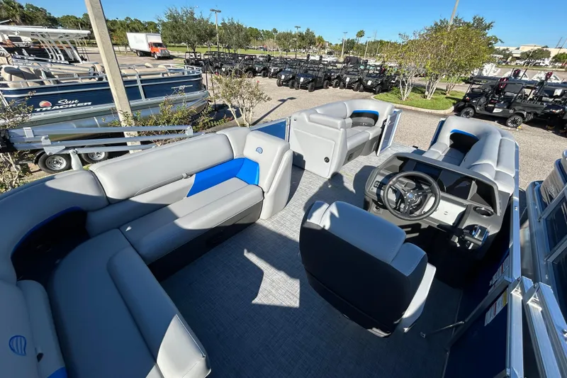 Slide: The Image of 2026 Sun Tracker Party Barge 20 DLX interior with seating and steering console. - 5