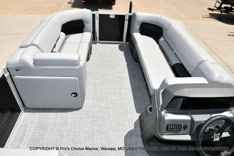 Slide: The Image of 2026 Sun Tracker Party Barge 20 DLX interior with spacious seating and modern helm. - 69