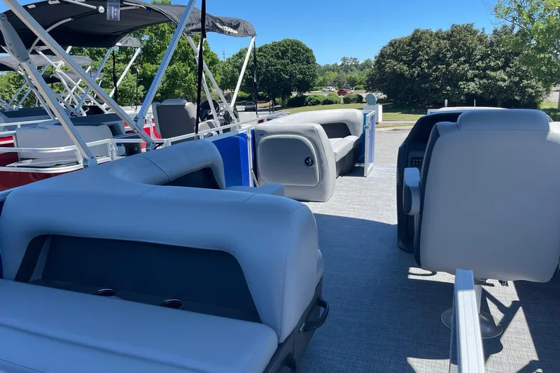 Slide: The Image of 2026 Sun Tracker Party Barge 18 DLX interior with plush seating and modern design. - 6