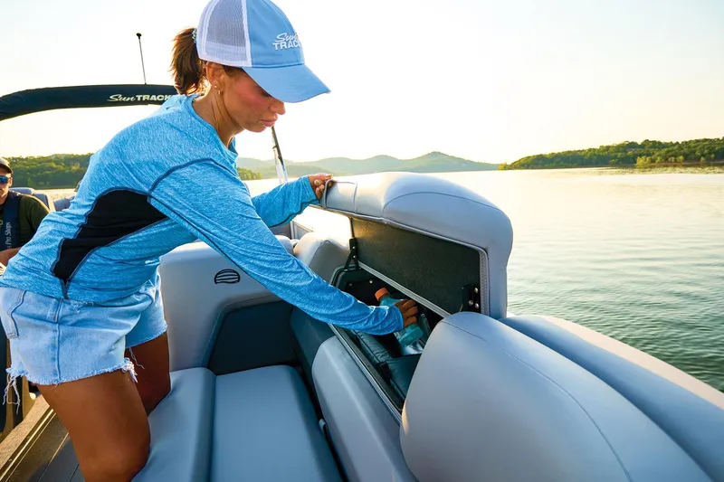 Slide: The Image of 2026 Sun Tracker Party Barge 22 XP3 interior with gray seating and cup holders. - 10