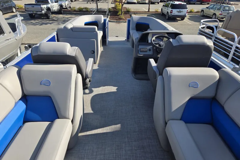 Slide: The Image of 2026 Sun Tracker Party Barge 22 DLX interior with spacious seating and modern helm. - 10