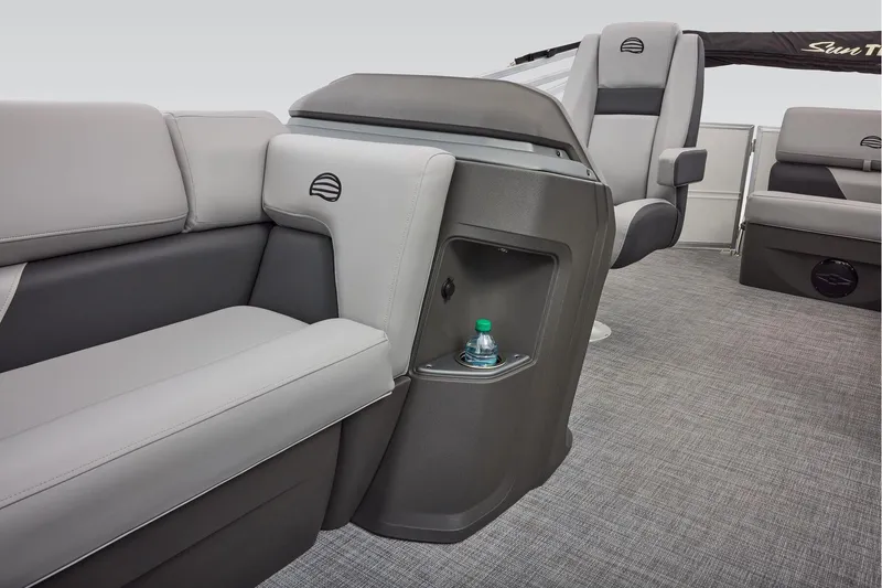 Slide: The Image of 2026 Sun Tracker Party Barge 20 DLX seating with cup holders, featuring red and white upholstery. - 25