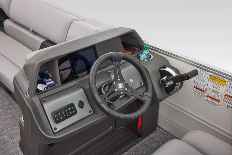 Slide: The Image of 2026 Sun Tracker Party Barge 20 DLX interior with gray and red seating. - 28