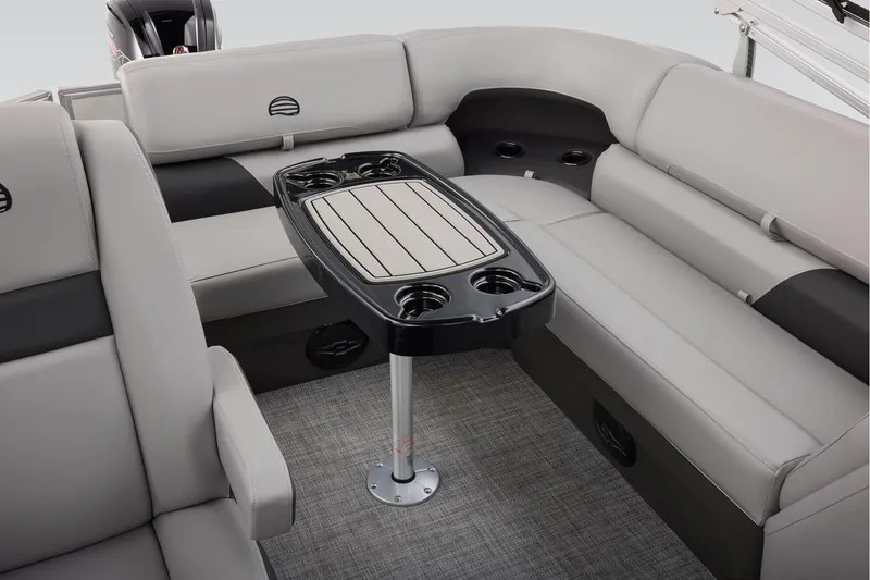 Slide: The Image of 2026 Sun Tracker Party Barge 20 DLX interior with storage compartment and seating. - 35