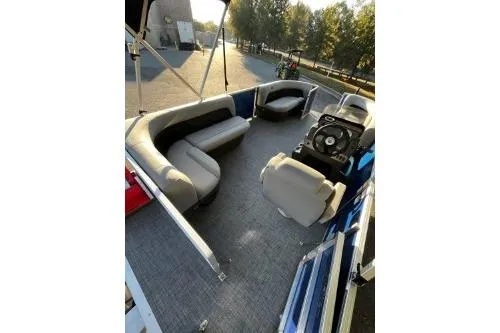 Slide: The Image of 2026 Sun Tracker Party Barge 16 DLX pontoon boat with spacious seating and modern design. - 7