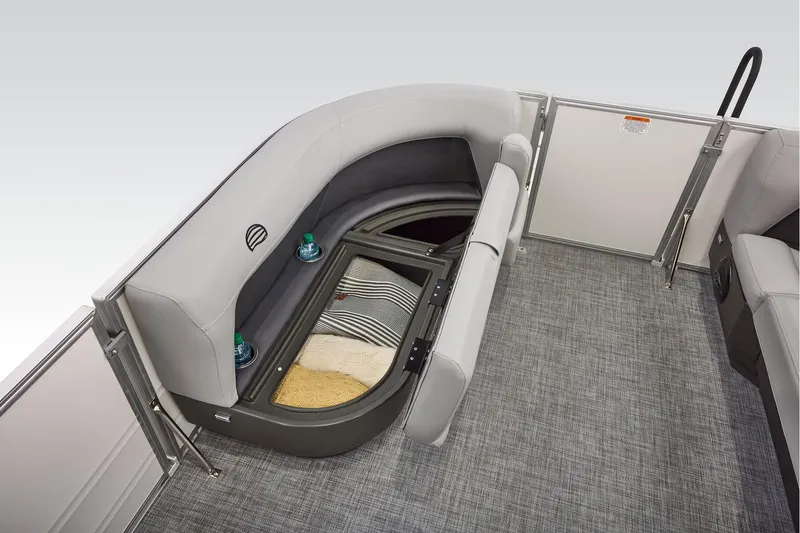 Slide: The Image of 2026 Sun Tracker Party Barge 16 DLX interior seating with cup holders, gray upholstery. - 14