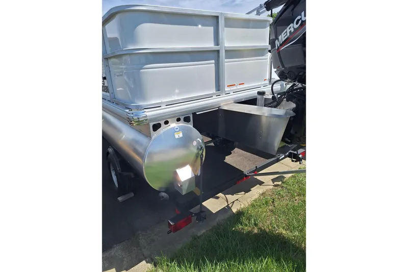 Slide: The Image of 2026 Sun Tracker Party Barge 18 DLX pontoon boat rear view with Mercury engine. - 6