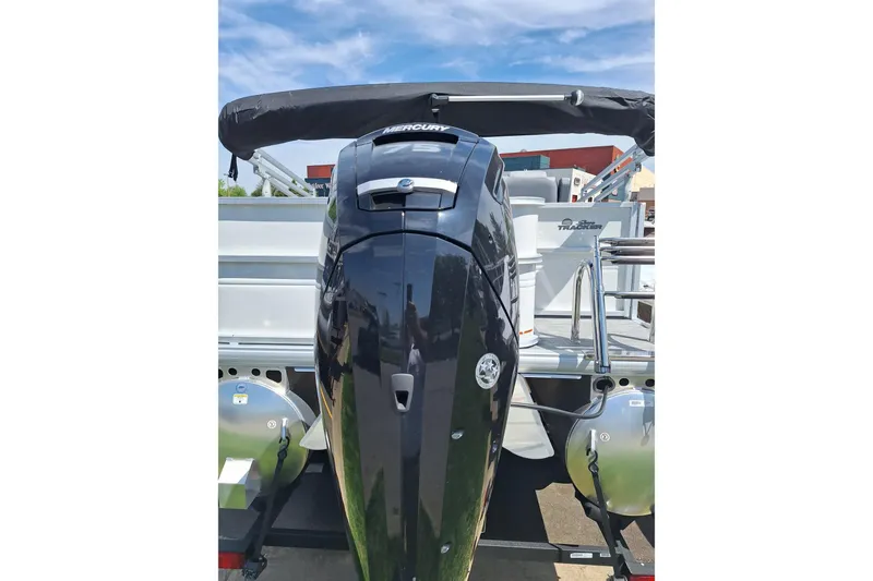 Slide: The Image of 2026 Sun Tracker Party Barge 18 DLX with Mercury outboard motor, rear view. - 7