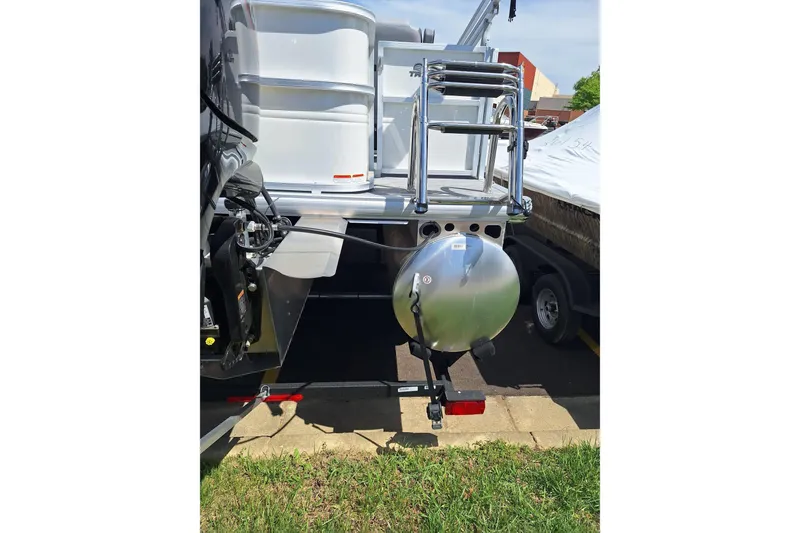 Slide: The Image of 2026 Sun Tracker Party Barge 18 DLX rear view with ladder and motor. - 8