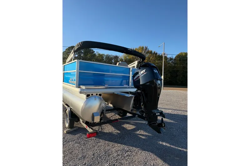Slide: The Image of 2026 Sun Tracker Party Barge 16 DLX pontoon boat with Mercury outboard motor. - 2