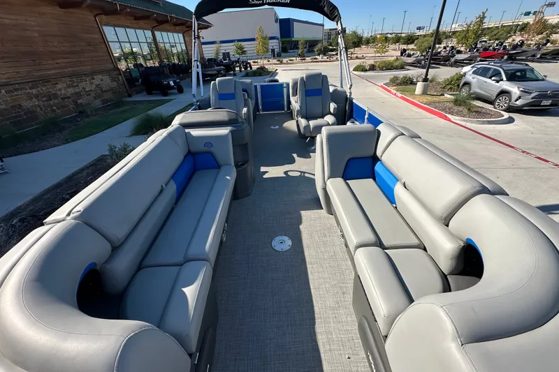 Slide: The Image of 2026 Sun Tracker Party Barge 22 DLX with spacious seating and modern design in a parking lot. - 39