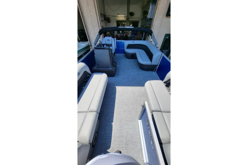 Slide: The Image of 2026 Sun Tracker Party Barge 20 DLX interior with spacious seating and modern design. - 6