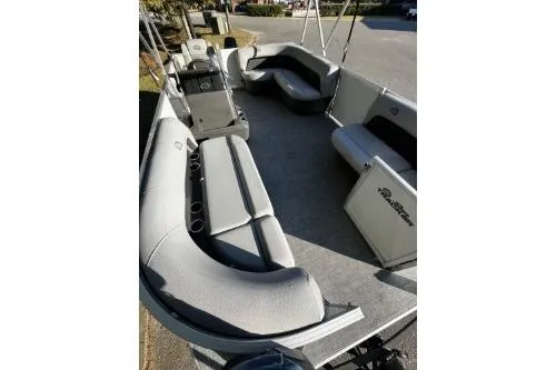 Slide: The Image of 2026 Sun Tracker Party Barge 16 DLX interior with spacious seating and modern design. - 4