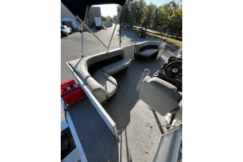 Slide: The Image of 2026 Sun Tracker Party Barge 16 DLX pontoon boat with spacious seating and canopy. - 6