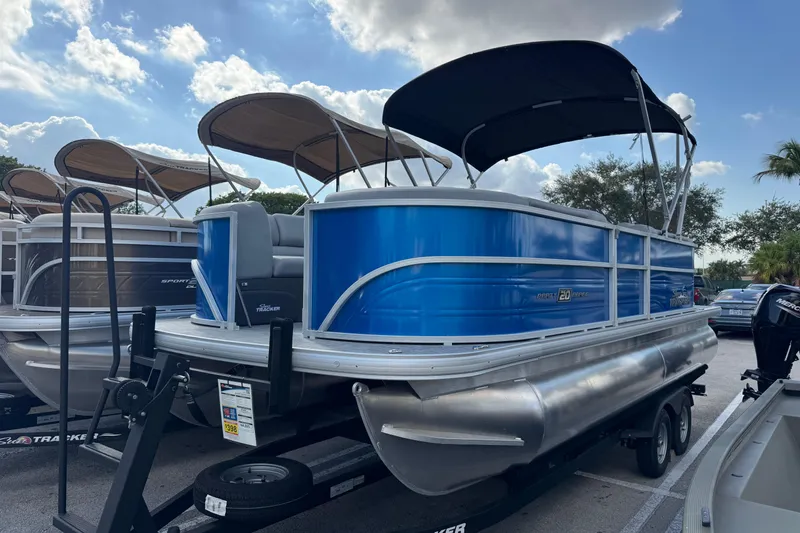 The Image of 2026 Sun Tracker Party Barge 20 DLX pontoon boat with blue exterior and canopy. - 0