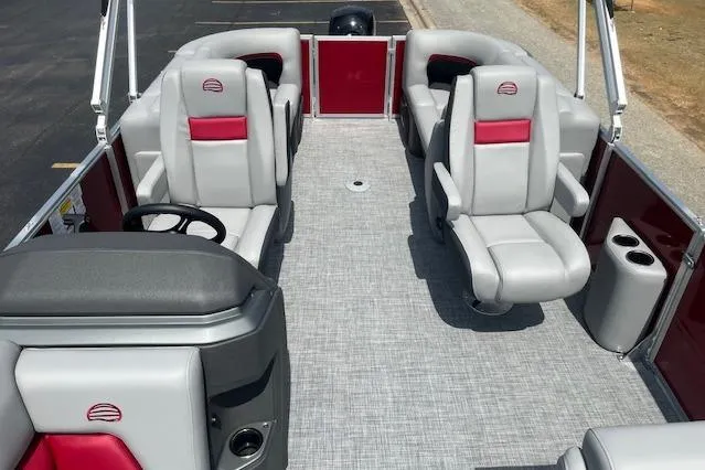 Slide: The Image of 2026 Sun Tracker Party Barge 22 DLX interior with gray and red seating, spacious layout. - 101