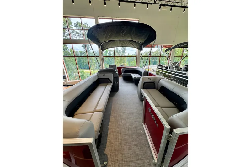 Slide: The Image of 2026 Sun Tracker Party Barge 18 DLX interior with spacious seating and canopy. - 1
