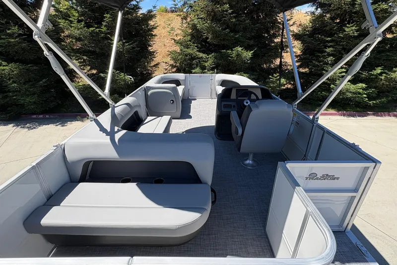 Slide: The Image of 2026 Sun Tracker Party Barge 18 DLX pontoon boat with spacious seating and canopy. - 20