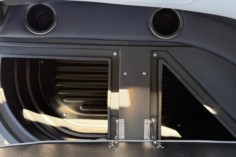 Slide: The Image of Interior storage compartment of 2026 Sun Tracker Party Barge 18 DLX with cup holders. - 35