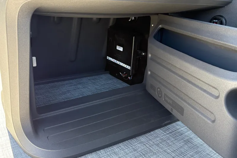 Slide: The Image of Storage compartment of 2026 Sun Tracker Party Barge 18 DLX pontoon boat. - 23