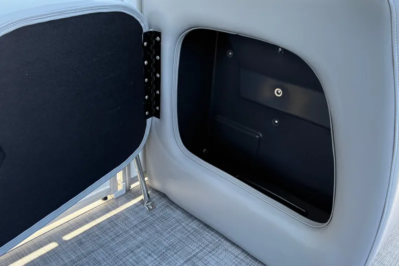 Slide: The Image of Open storage compartment on 2026 Sun Tracker Party Barge 18 DLX pontoon boat. - 32