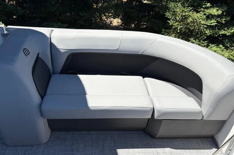 Slide: The Image of 2026 Sun Tracker Party Barge 18 DLX with sleek gray seating and modern design. - 33