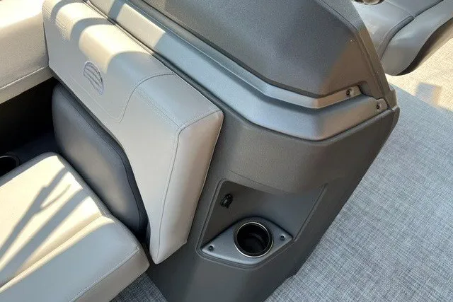 Slide: The Image of 2026 Sun Tracker Party Barge 18 DLX interior seating with cup holder detail. - 12