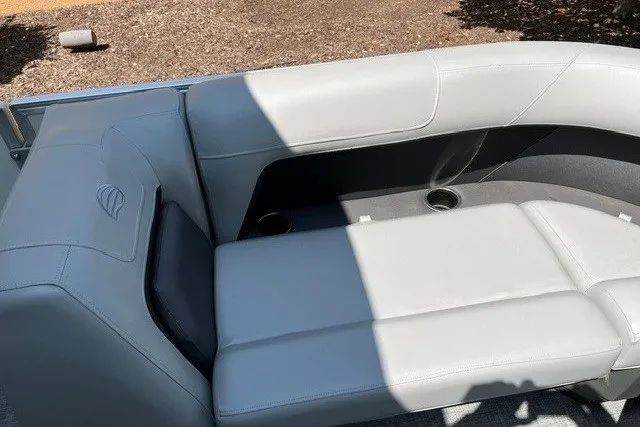 Slide: The Image of 2026 Sun Tracker Party Barge 18 DLX, white seating area with cup holders. - 15