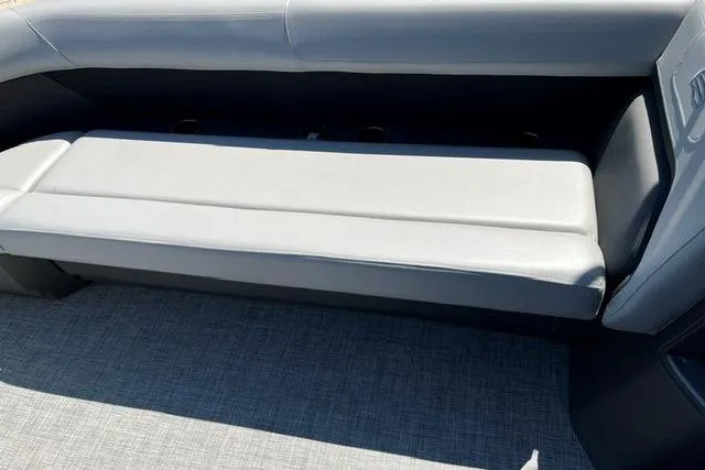 Slide: The Image of 2026 Sun Tracker Party Barge 18 DLX interior seating with gray upholstery. - 6